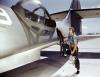 Jesse Rhodes Waller, Trabalhador da força aérea na Estação Aérea Naval em Corpus Christi, Texas, a instalar uma metralhadora Browning M1919 num avião PBY da Marinha dos EUA.